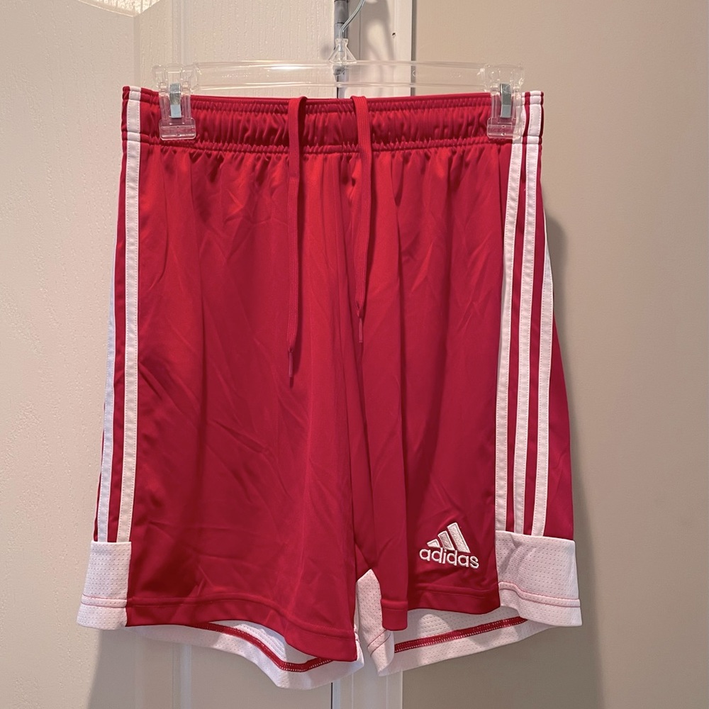 Red Adidas athletic shorts